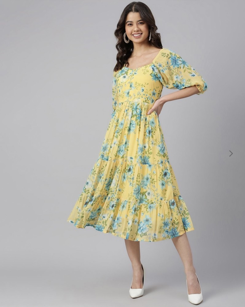 Light blue store and yellow dress