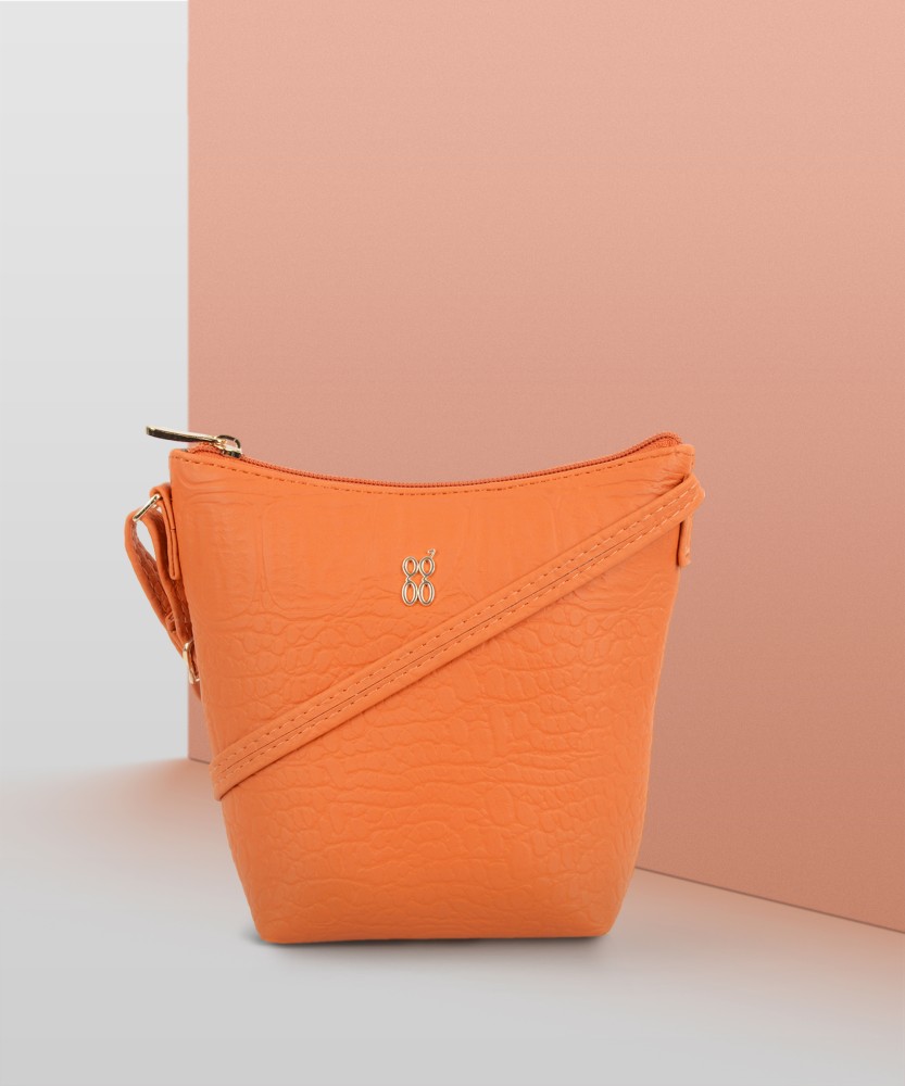 Baggit orange sling online bag