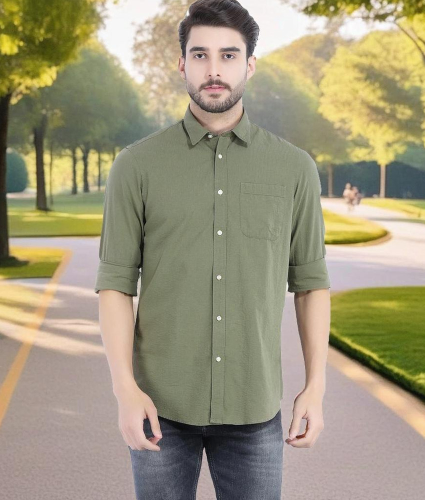 Olive green shirt with dark 2025 blue jeans