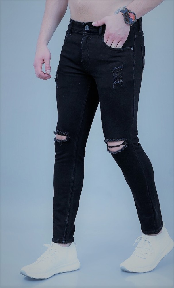 Black jeans best sale with cuts