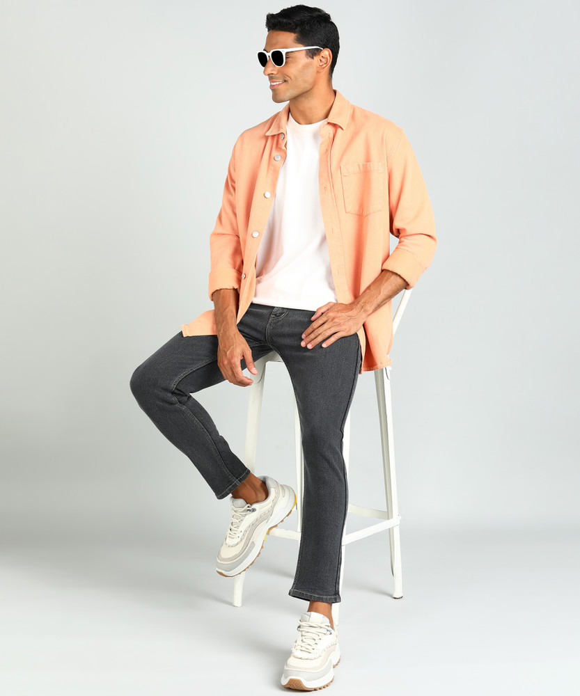 pink shirt grey jeans