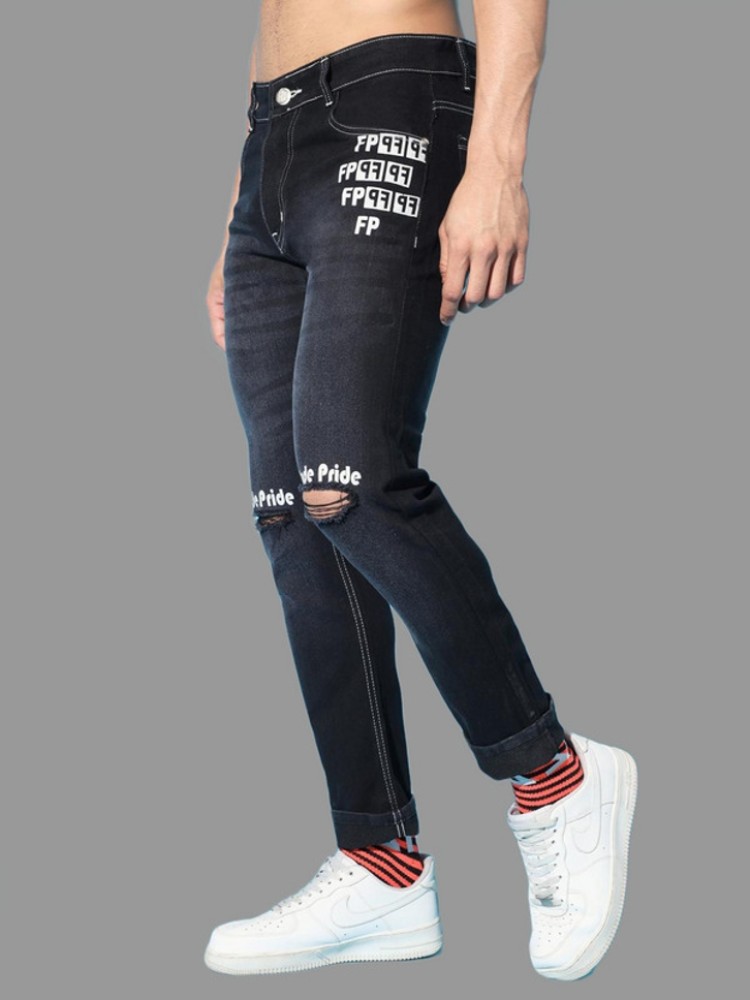 Black jeans with shops white writing