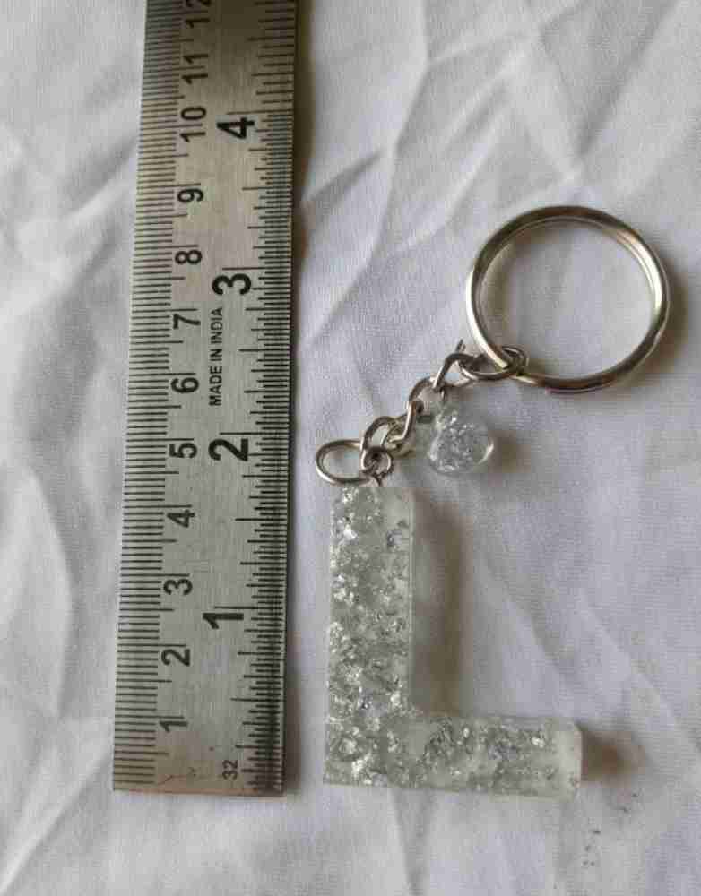 https://rukminim2.flixcart.com/image/850/1000/xif0q/key-chain/4/u/x/clear-silver-flakes-resin-art-keychain-brightfashion-1-original-imagpkf2zbhn3aty.jpeg?q=20