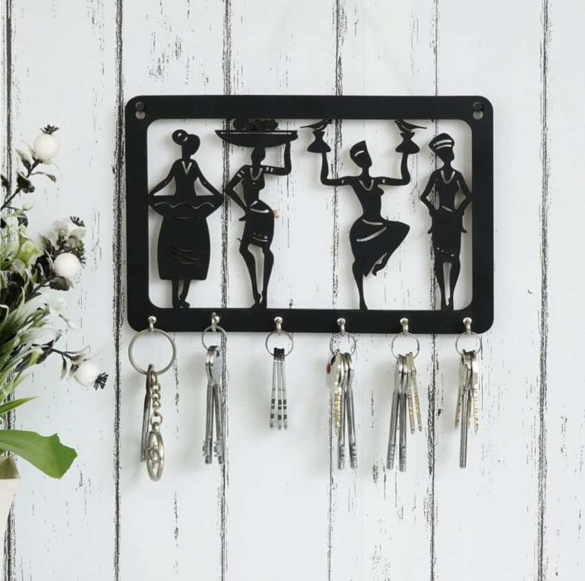 Designer key holder for wall outlet