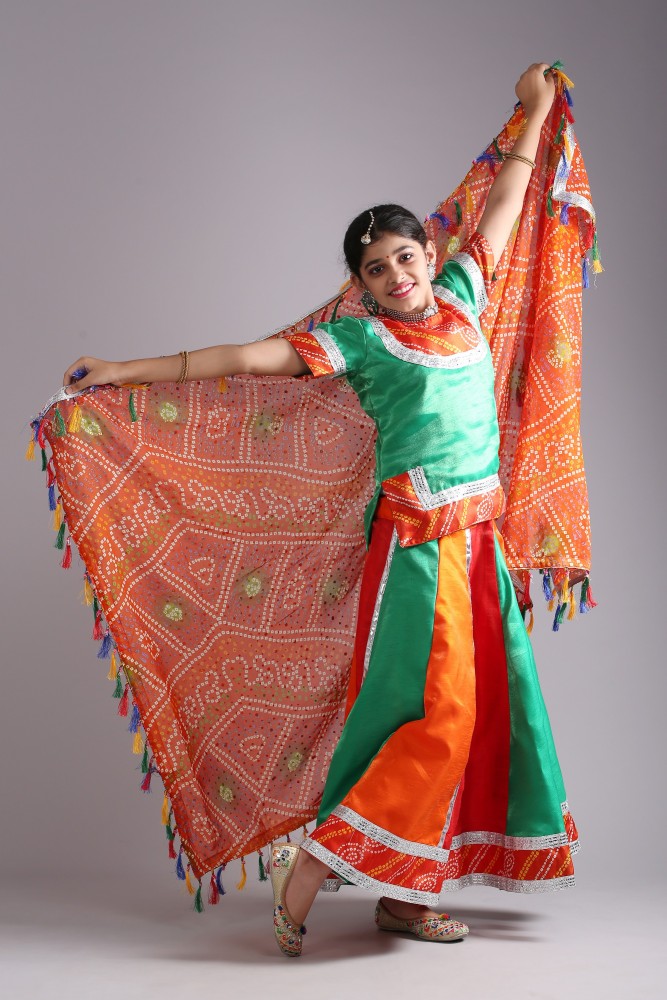 Woman dancing in bright red lehenga choli Stock Photo - Alamy