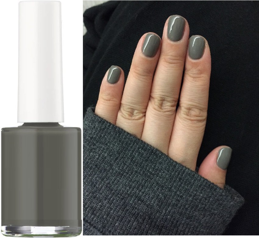 Female Hand With Long Nails Light Gray Manicure And A Bottle Of Nail Polish  Stock Photo, Picture And Royalty Free Image. Image 181287154.