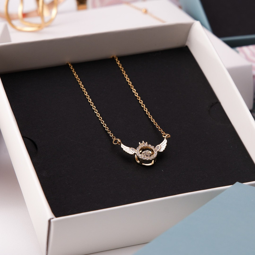 Rose gold and black wing necklace top