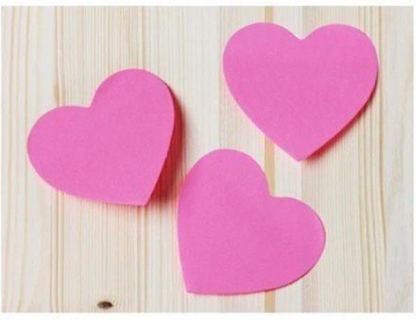 some heart-shaped sticky notes of different colors with a blank