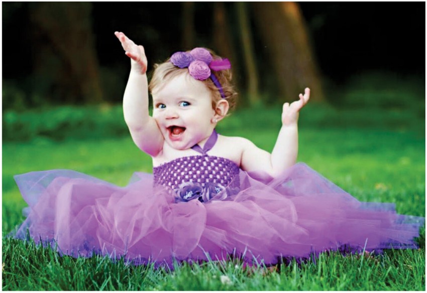 Cute Smiley Girl Baby Is Sitting On Green Grass Wearing Purple Frock And Flower Band On Head Having Hands In The Air Cute Baby Posters Baby Girl Boy Poster Smiling