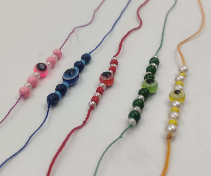 handmadearts Thread Combo of 5 Evil Eye Handmade Rakhi for Brother Plastic PVC Rakhi Set Price in India Buy handmadearts Thread Combo of 5 Evil Eye Handmade Rakhi for Brother Plastic