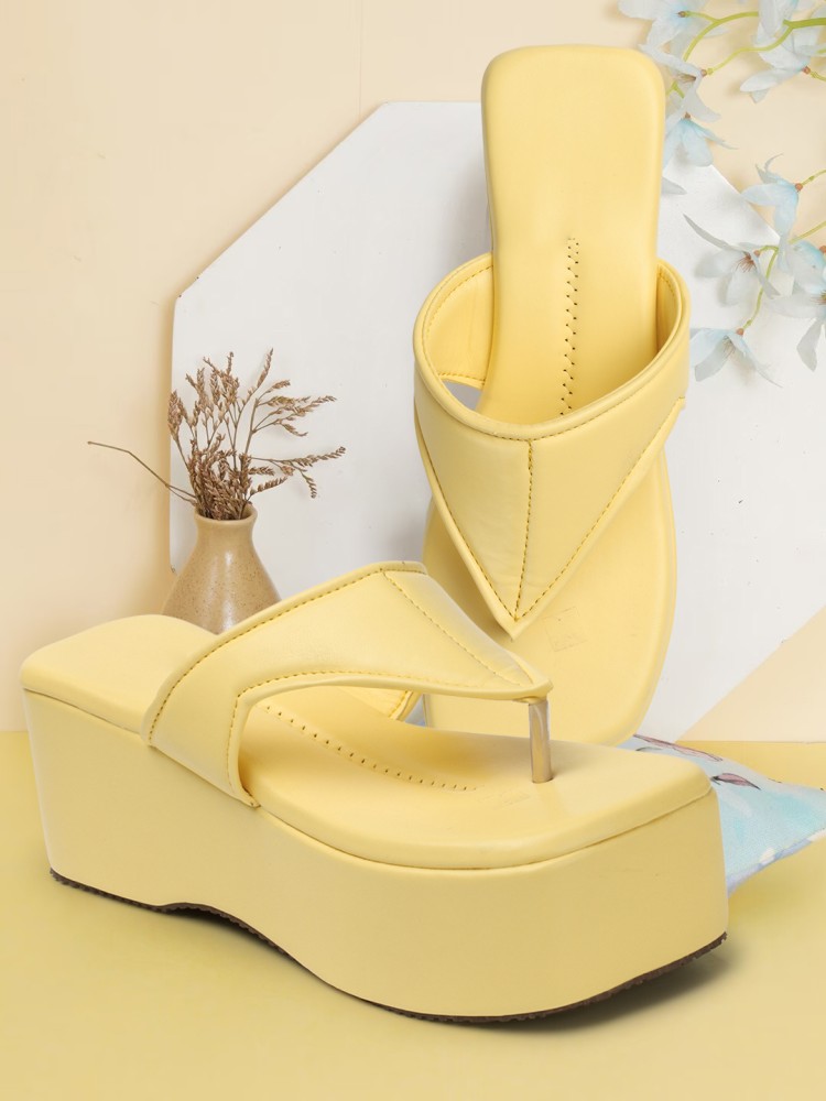 Yellow wedge store flip flops