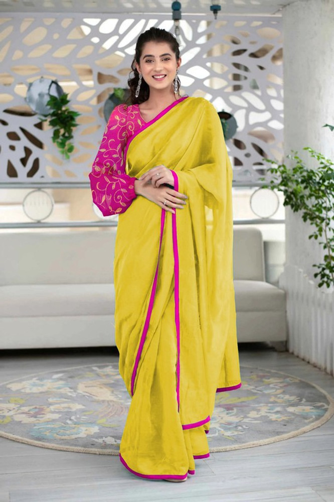 yellow plain saree with pink blouse