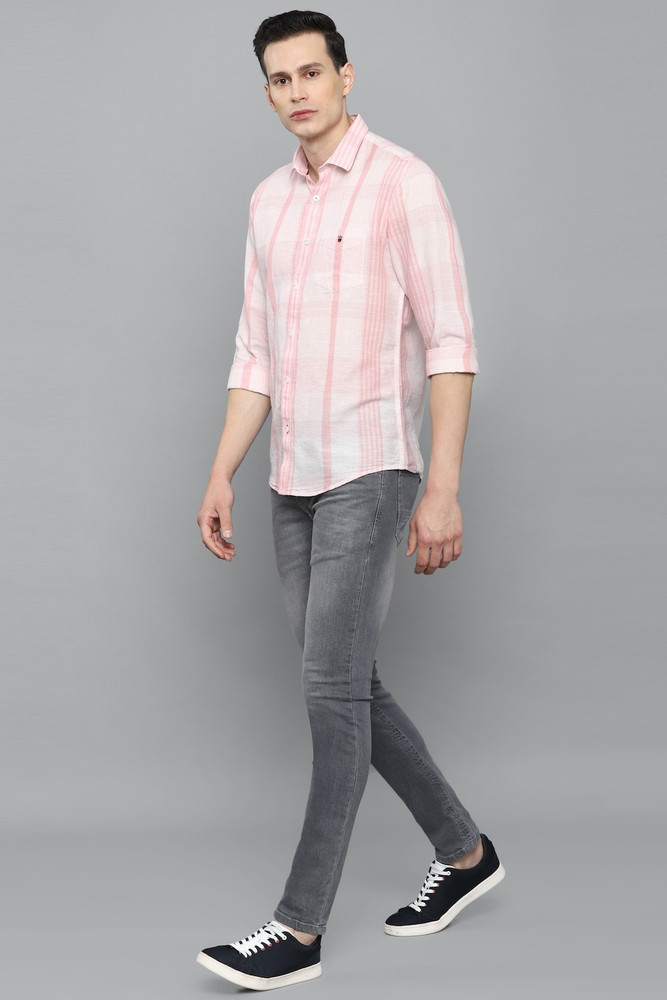 pink shirt grey jeans