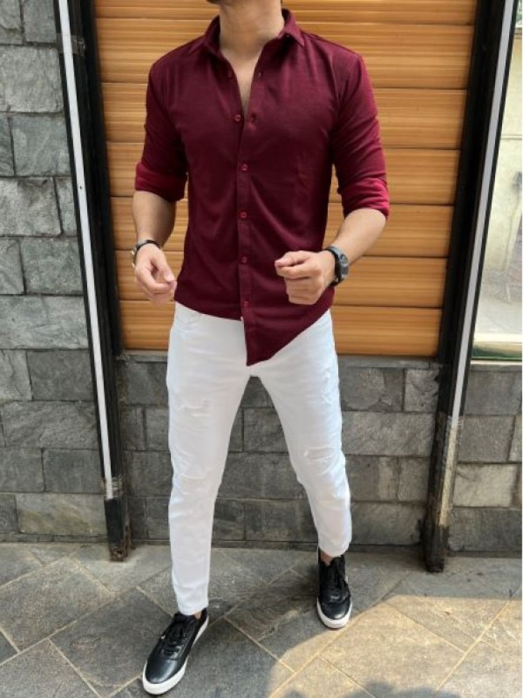 maroon shirt white pants