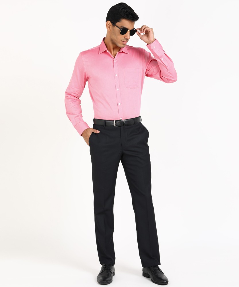 Woman Wearing Pink Offshoulder Shirt and Black Pants While Standing Near  Wall  Free Stock Photo