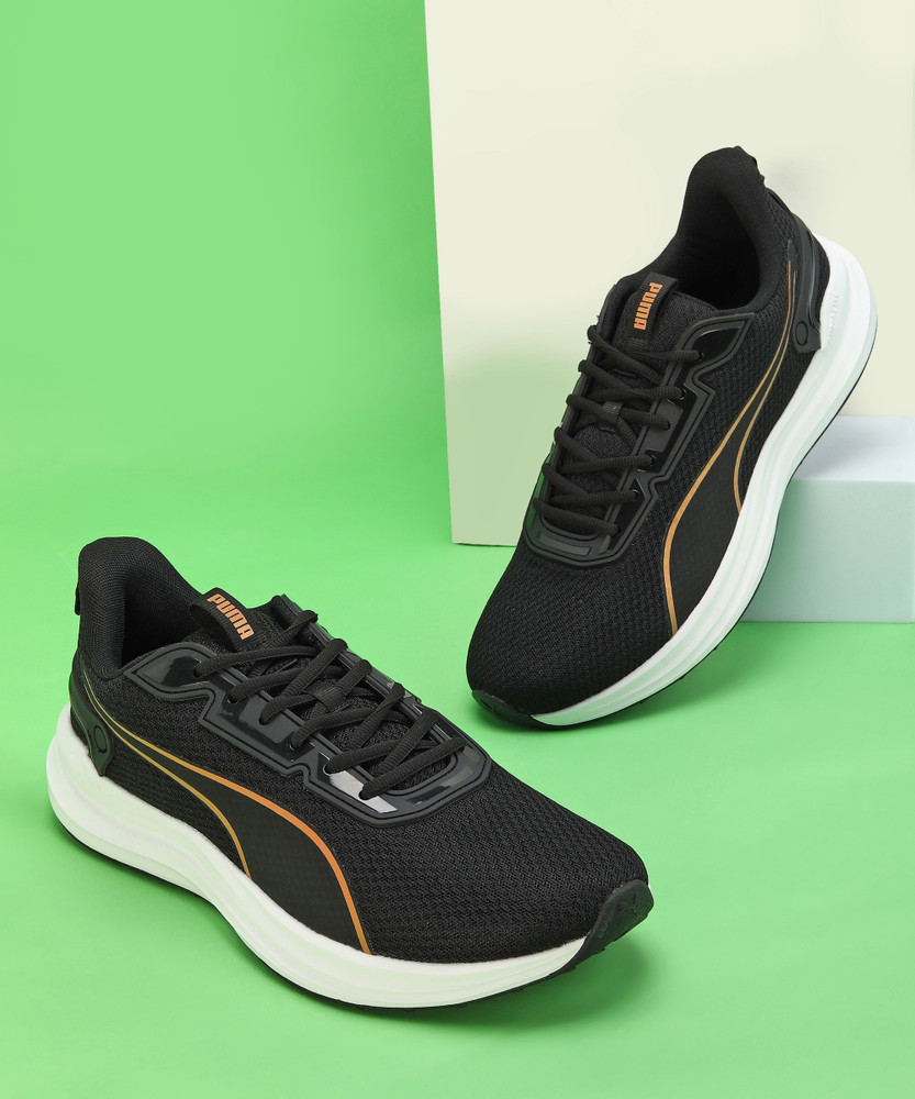 puma black and gold running shoes