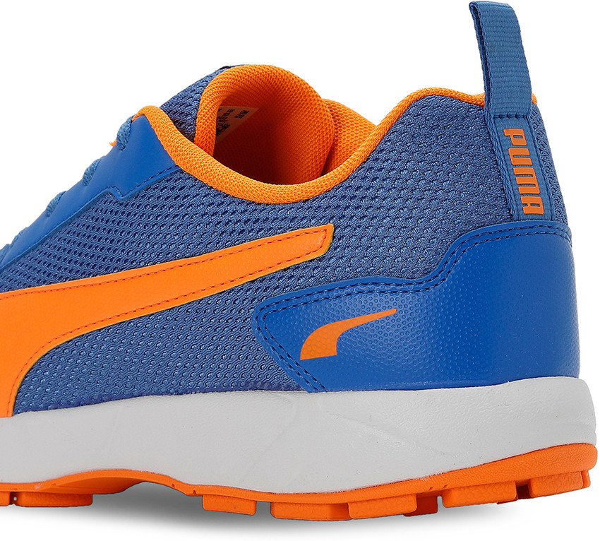 Orange top puma trainers