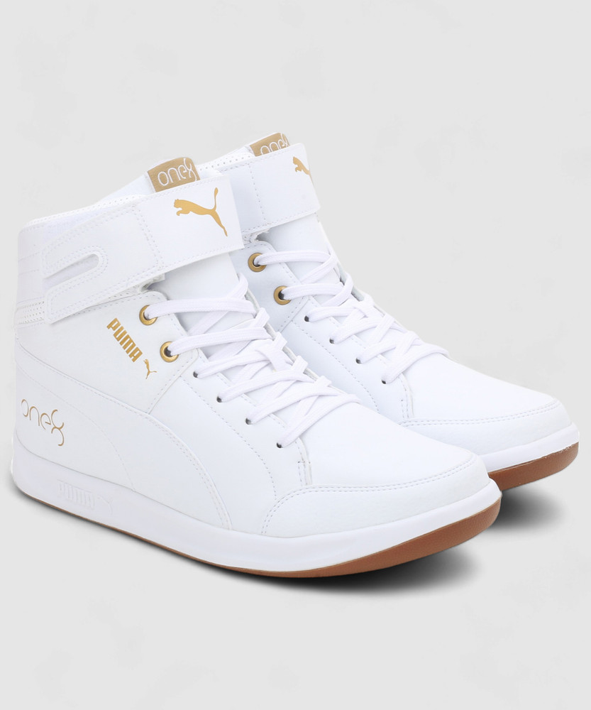 white and gold high top pumas