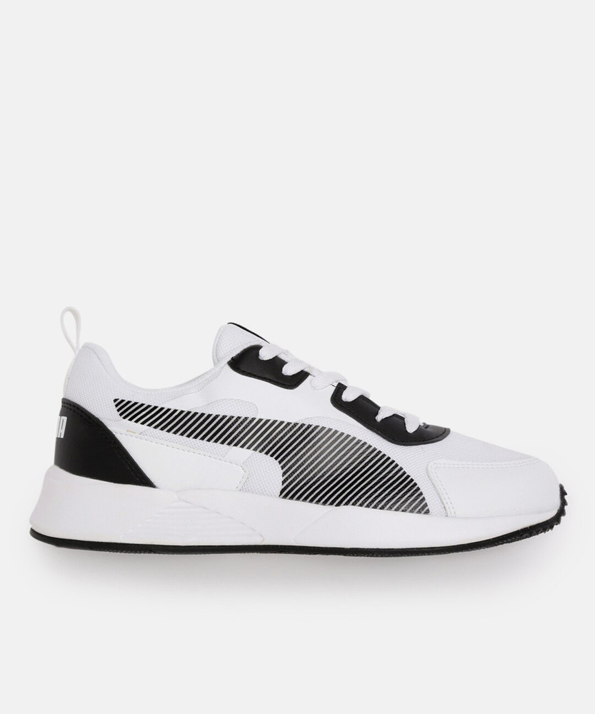 white puma shoes with black stripe