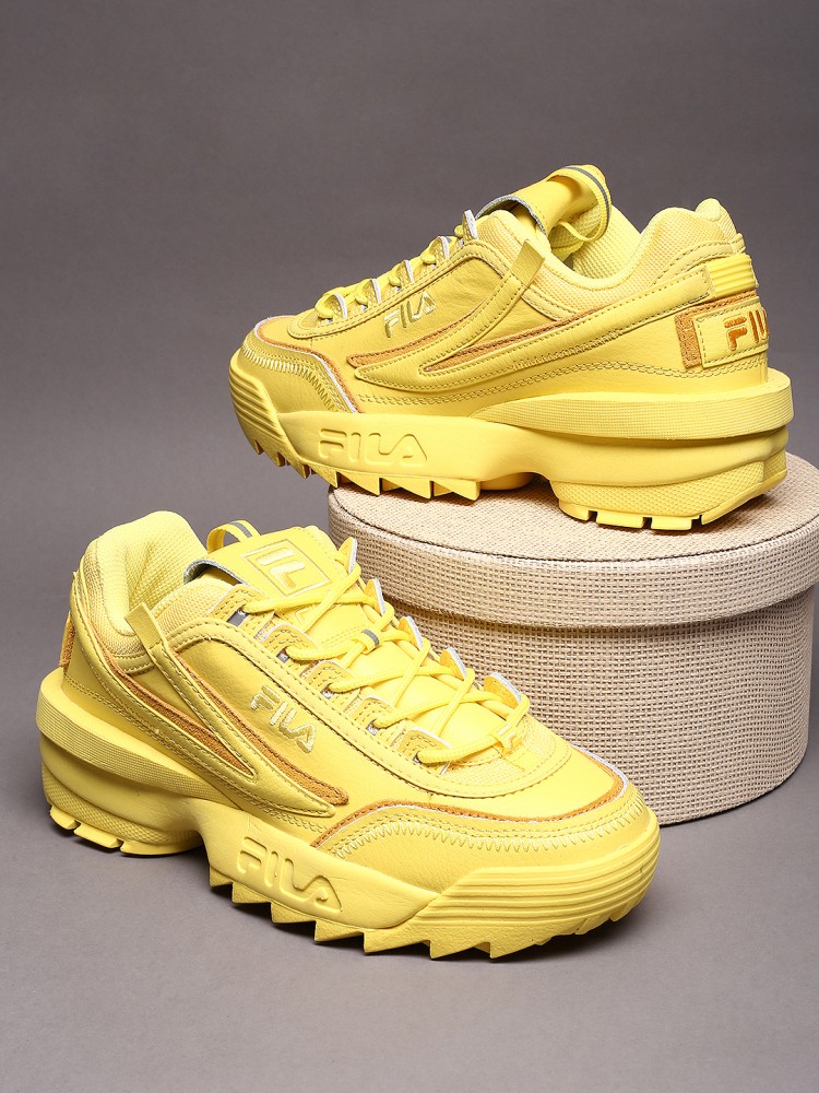 Fila yellow store tennis shoes