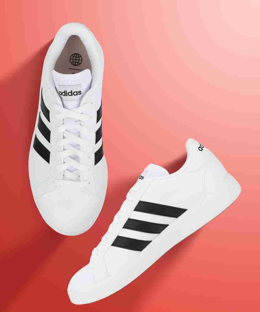 Adidas white shoe with black discount stripes