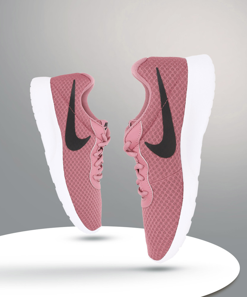 Nike tanjun pink best sale white
