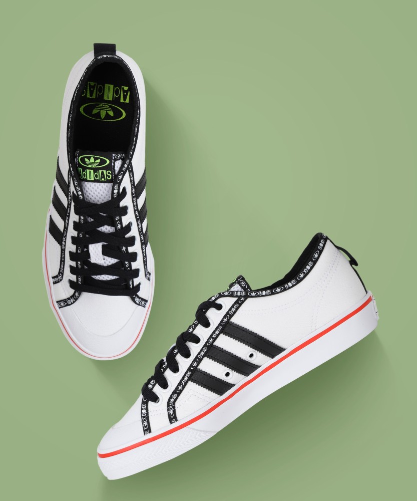 Adidas originals black hotsell and white nizza sneakers