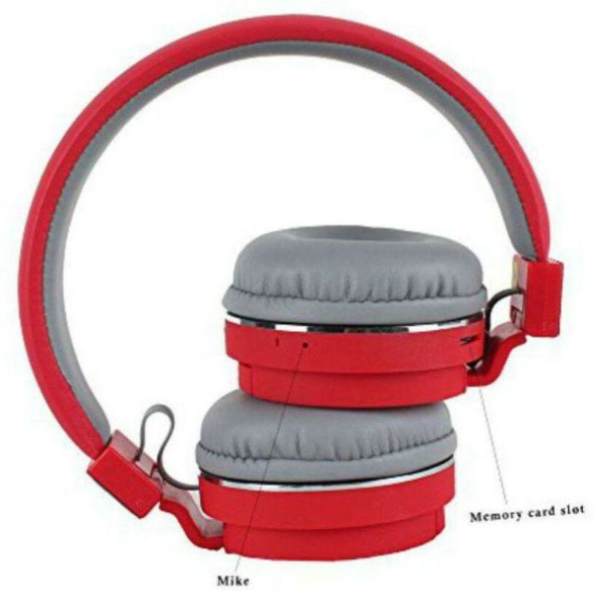 Headphones with memory card slot outlet
