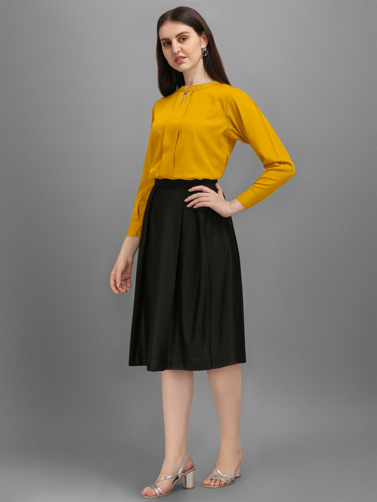 yellow top with black skirt
