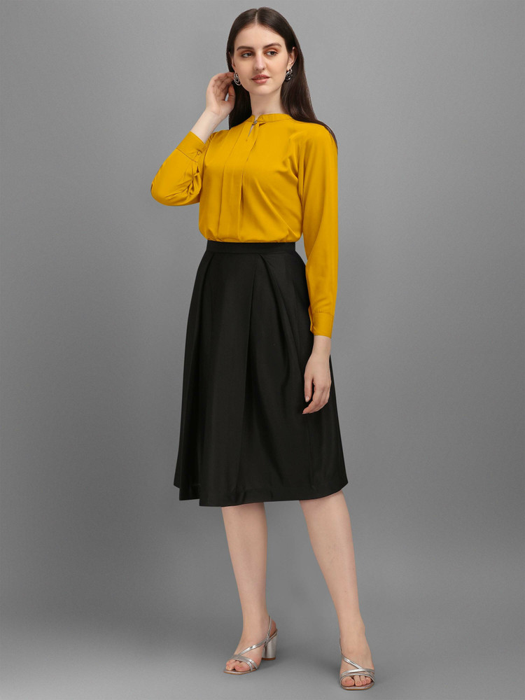 black top yellow skirt