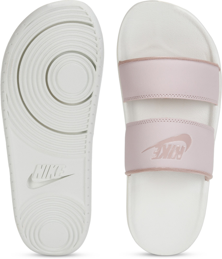 Nike benassi pink hotsell and white