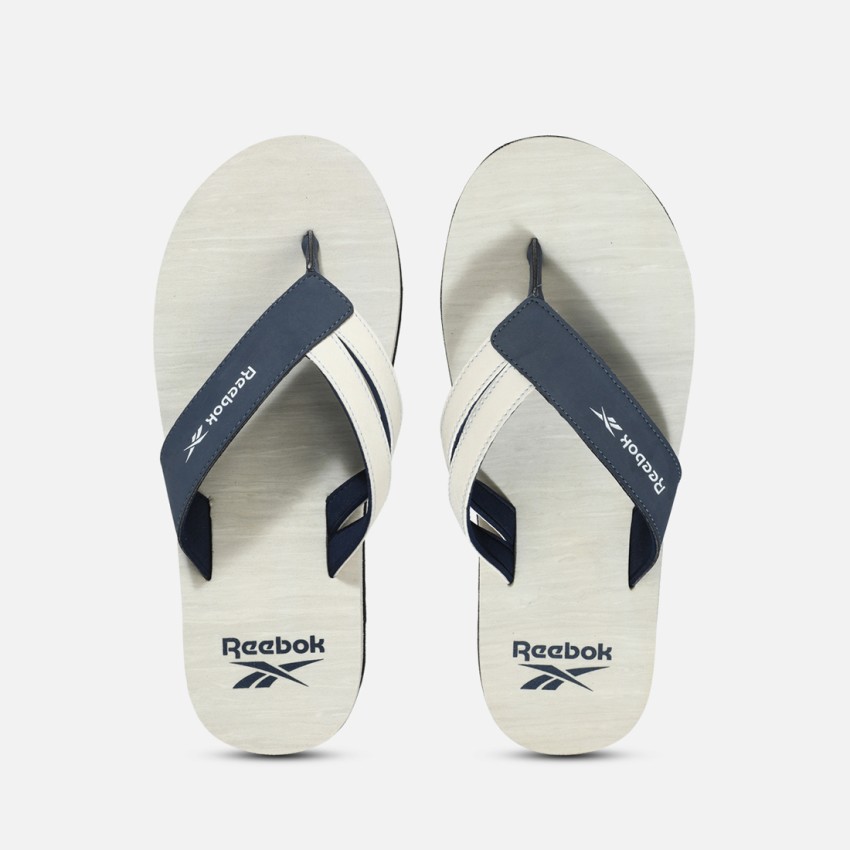 Reebok white store flip flops