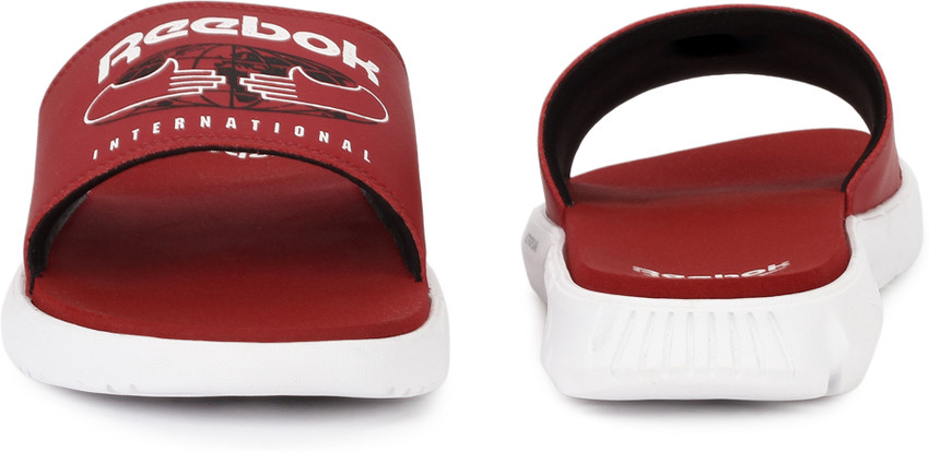 red reebok slides