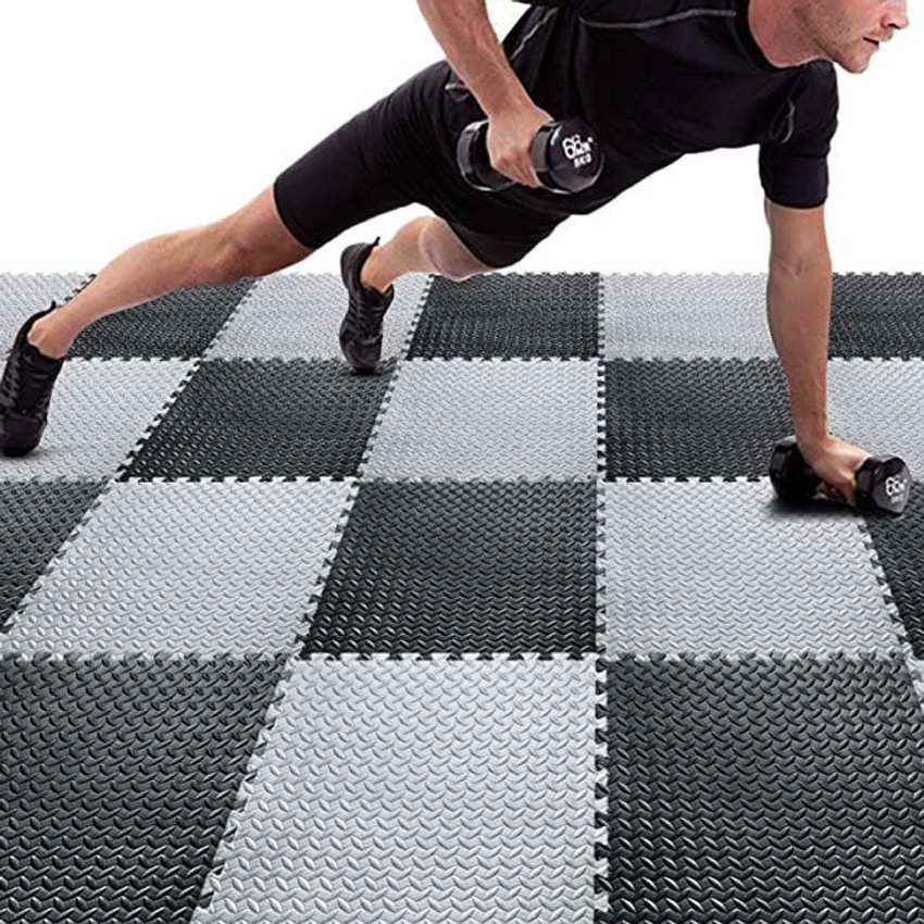 Padded floor mats for gym top
