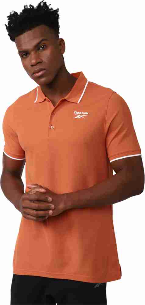 Buy REEBOK Solid Men Polo Neck Orange T Shirt Online at Best