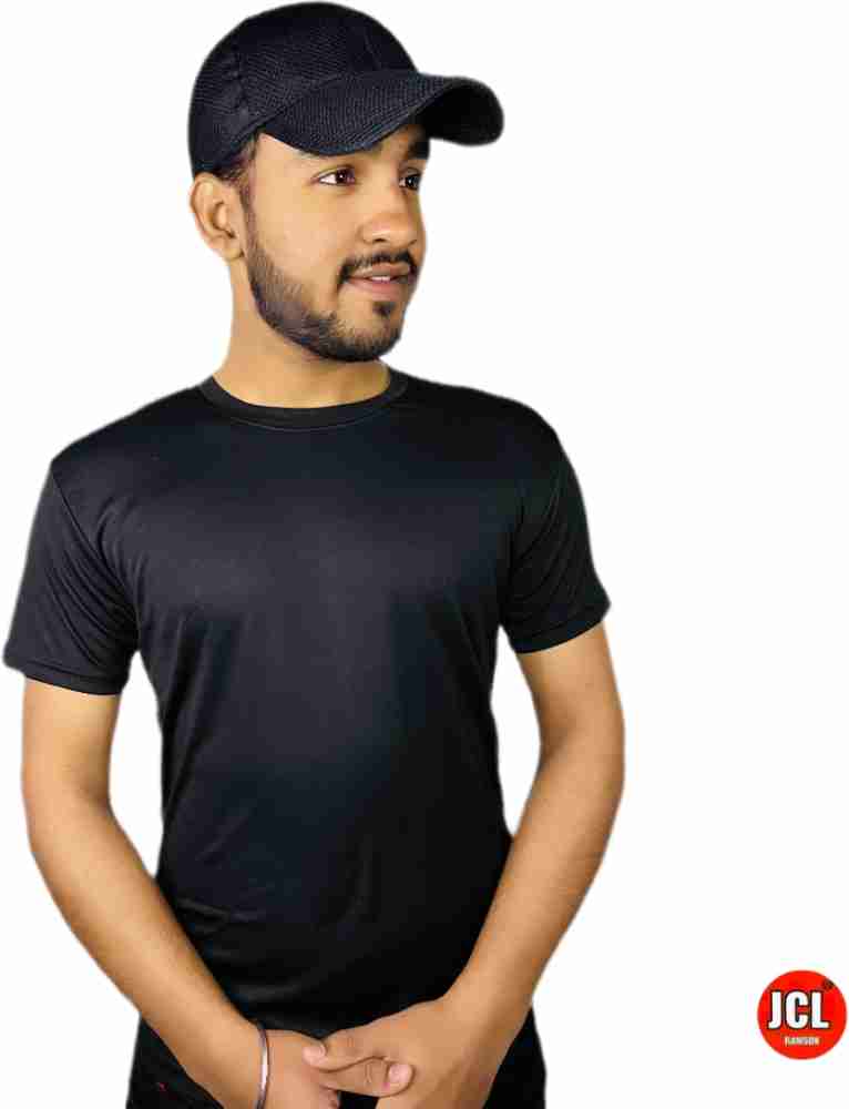 Man in black and white crew neck t-shirt wearing gray cap photo