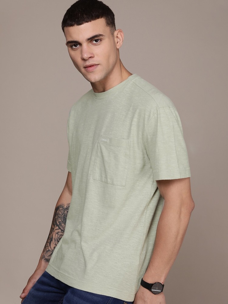 Calvin Klein Jeans Solid Men Round Neck Green T-Shirt - Buy Calvin Klein  Jeans Solid Men Round Neck Green T-Shirt Online at Best Prices in India