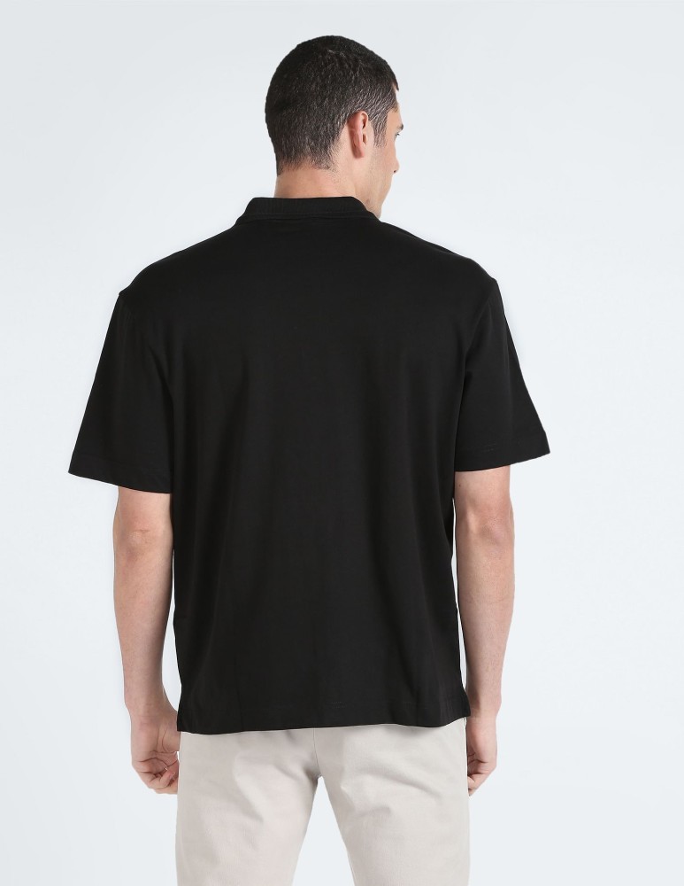Calvin Klein Jeans Solid Men Polo Neck Black T-Shirt - Buy Calvin Klein  Jeans Solid Men Polo Neck Black T-Shirt Online at Best Prices in India