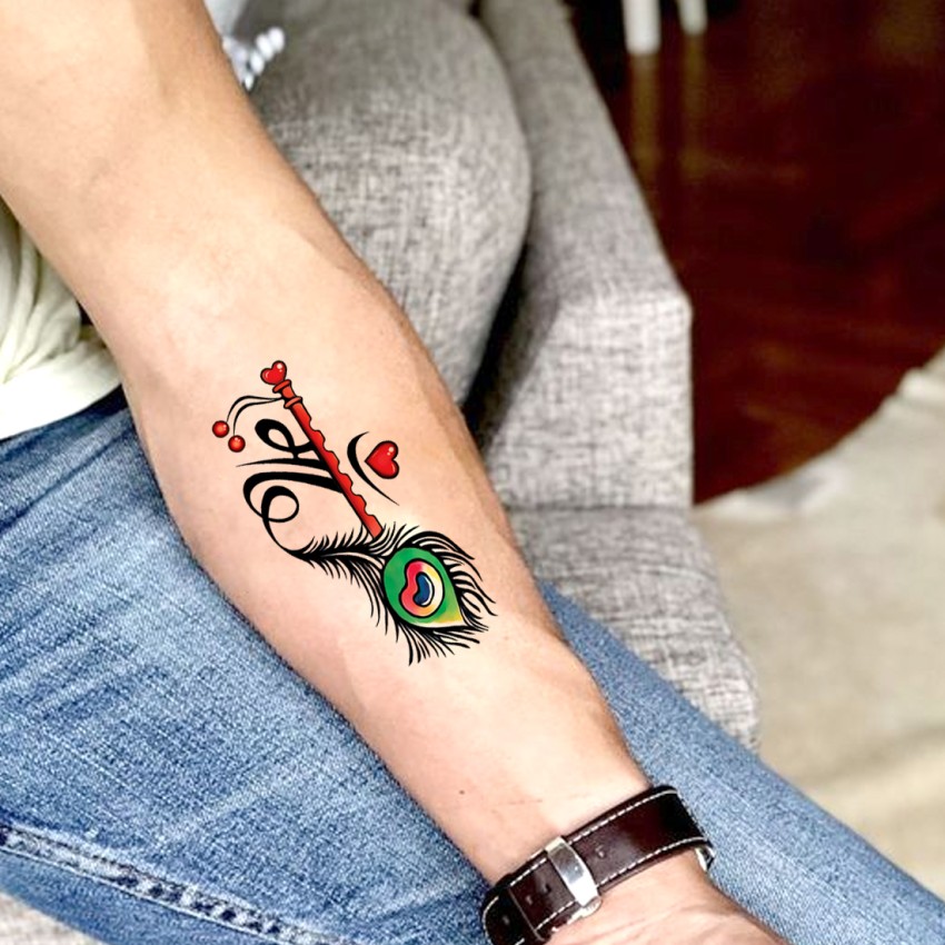 Beautiful Peacock Feather Tattoo on Hand  Tattoo Ink Master