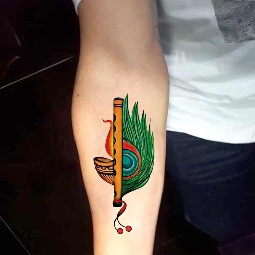 Peacock feather tattoo Bansuri tattoo colourful  by Rtattoostudio on  DeviantArt