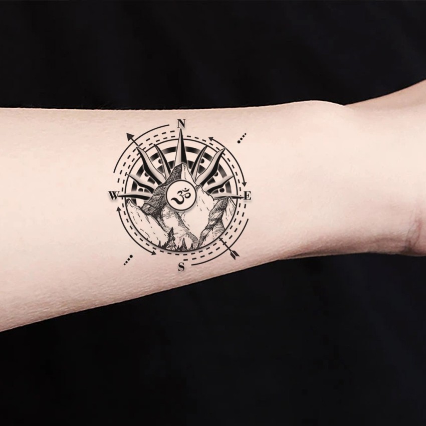 Compass with plane tattoo for travel enthusiasts