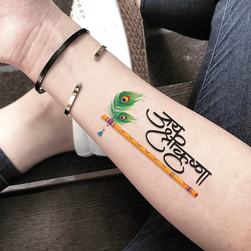 Colorful Feather Tattoo with the Name Krishna  Black Poison Tattoos