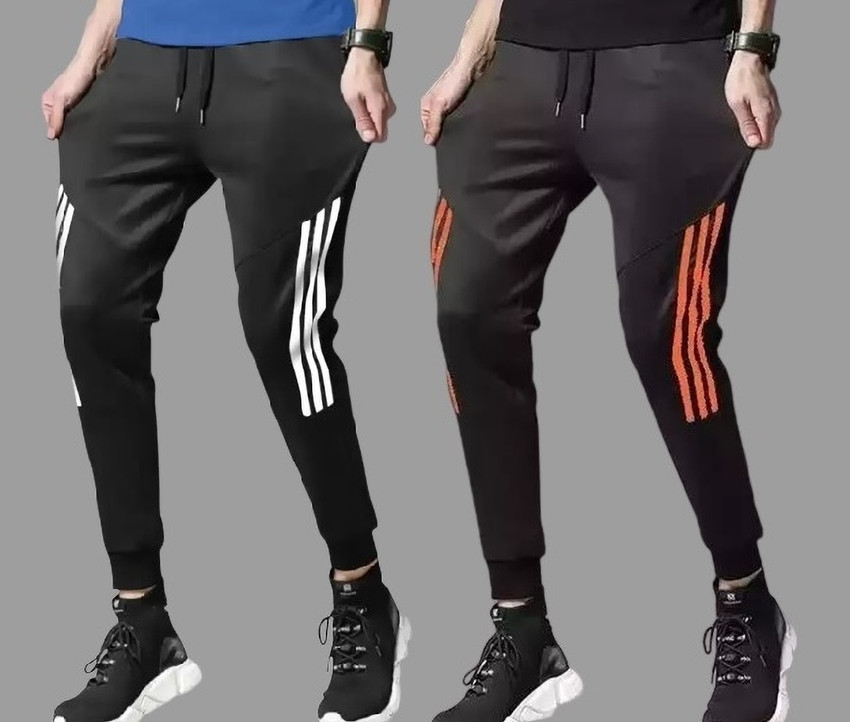 Orange and white track pants on sale