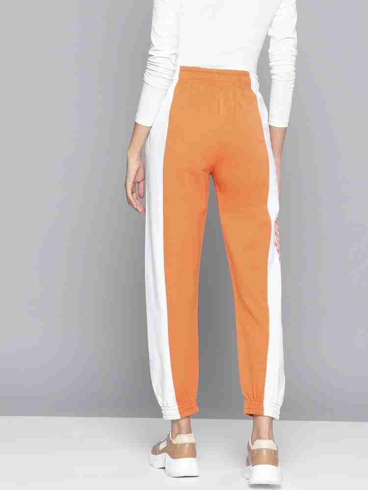 Orange and white discount track pants