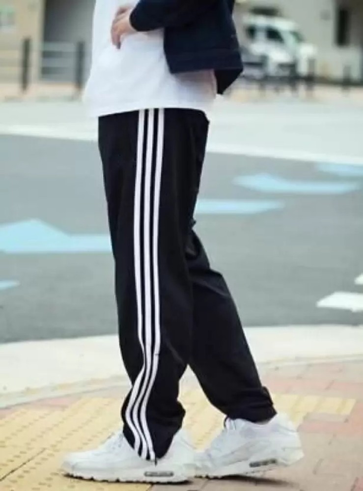 Black tracksuit bottoms with white stripe online