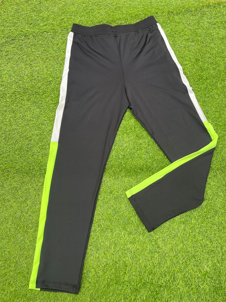 Black and lime store green adidas pants