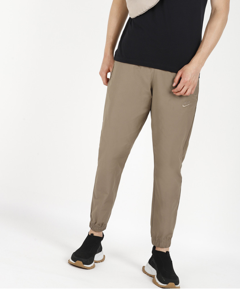 Nike swoosh cuffed top woven sweatpants in khaki