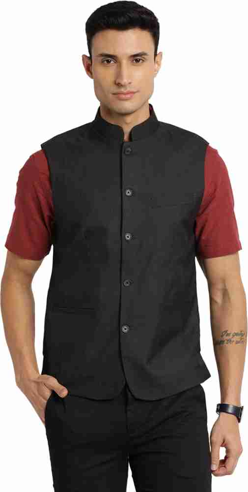 red shirt with black waistcoat