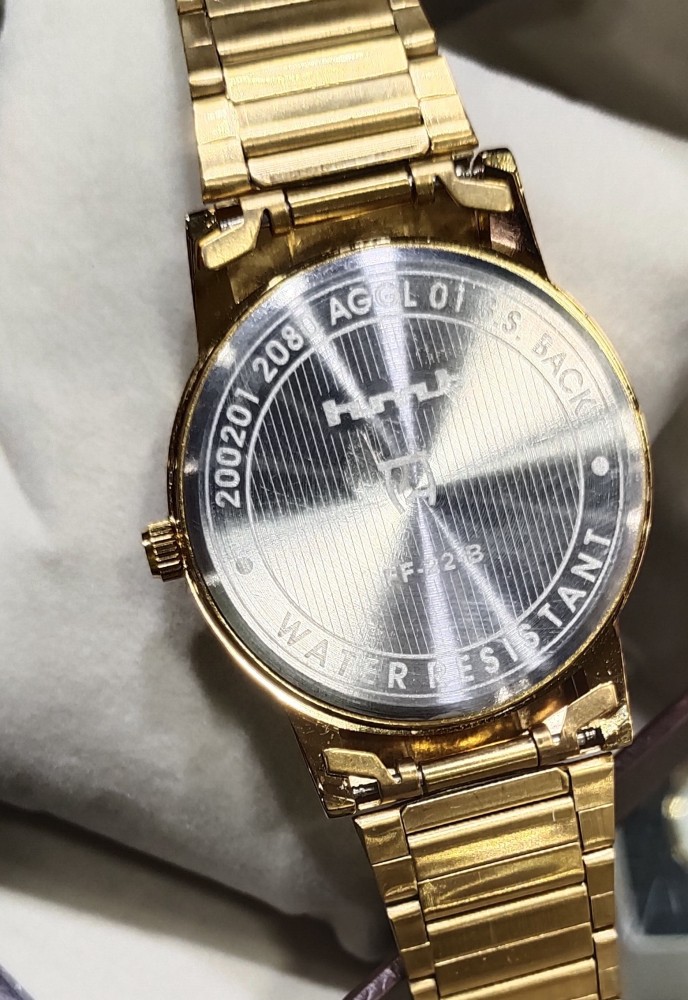 Hmt quartz 2025 watches golden