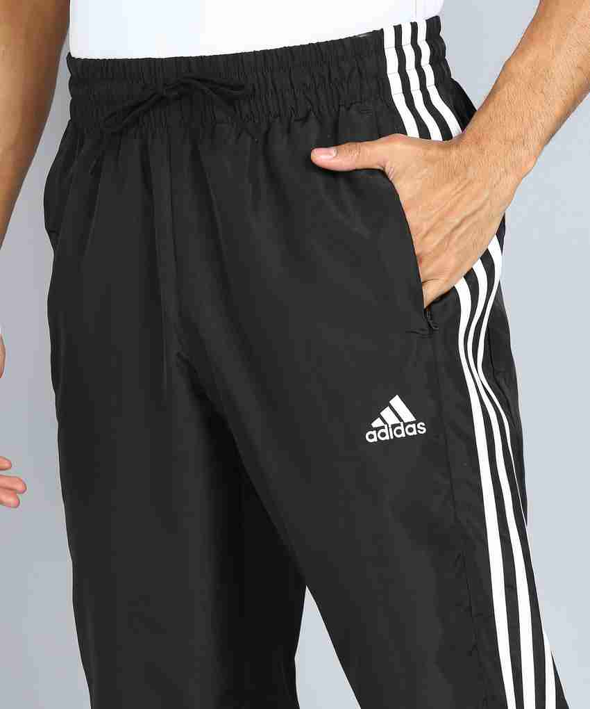 Black adidas pants with black stripes online